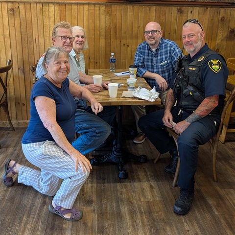 City Manager Thomas Hill (top right, blue plaid shirt) with Gardiner Police Chief and community residents at Sunrise Bagel